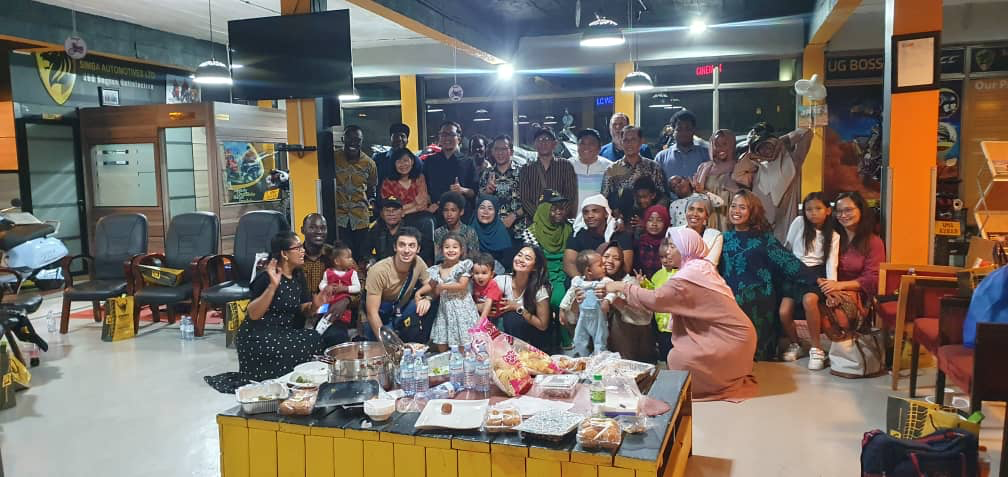 Community gathering with families at Simba Automotives