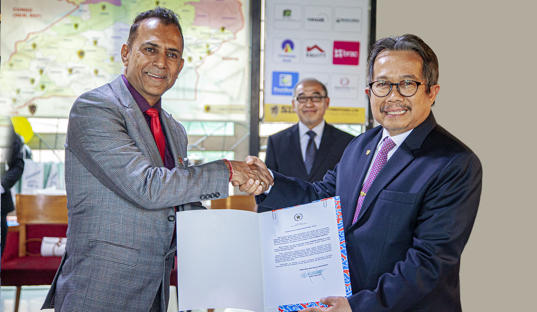 Mr. Paresh Shukla receiving his appointment certificate as Honorary Consul, signed by President Joko Widodo