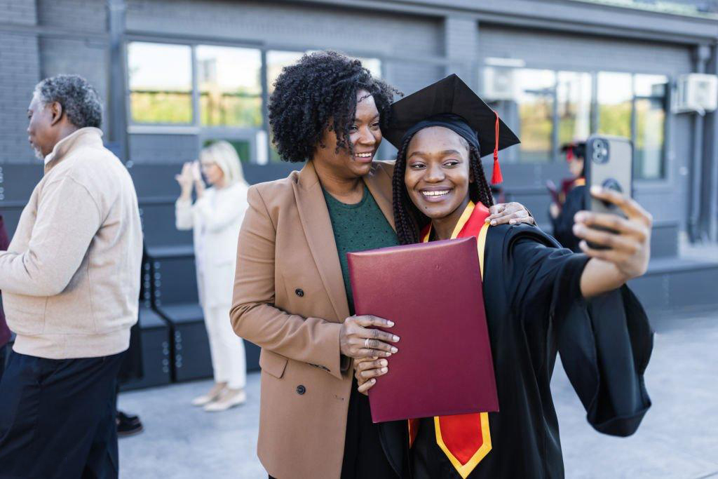 Graduate celebrating with a family member